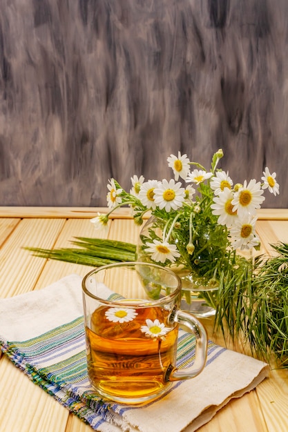 Chamomile tea. Fresh flowers, summer hot drink concept. Alternative medicine, lifestyle