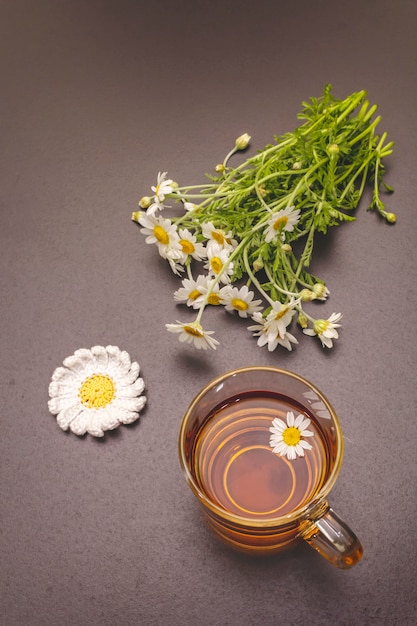 Chamomile tea. Fresh flowers, summer hot drink concept. Alternative medicine, lifestyle