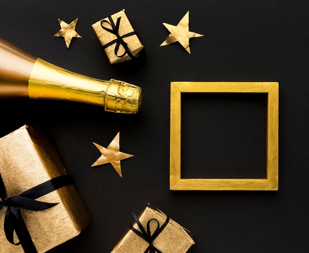 Champagne bottle with gifts on table