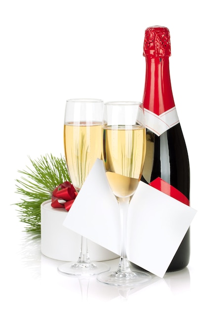 Champagne christmas gift and empty greeting card