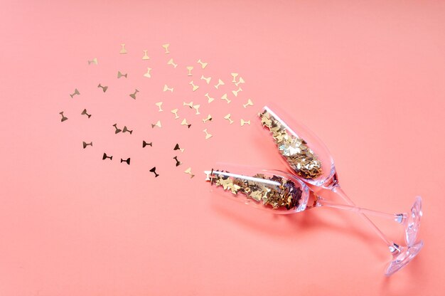 Champagne Glasses with Golden Confetti. New year celebration