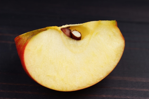 Champion apple on a black surface