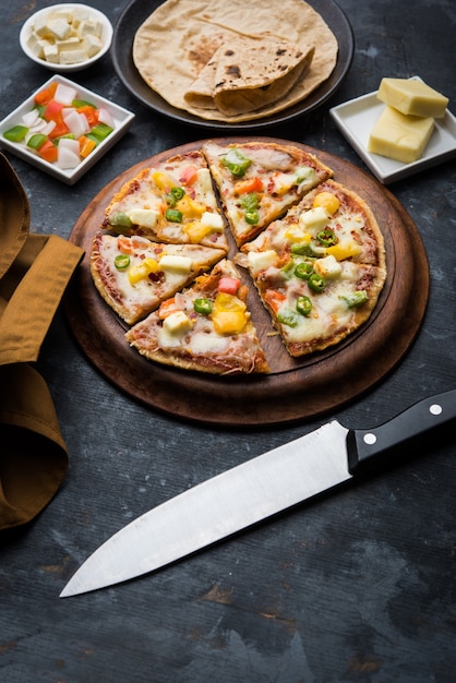 Chapati Pizza made using leftover Roti, Paratha with Cheese, vegetables, paneer and Sausage