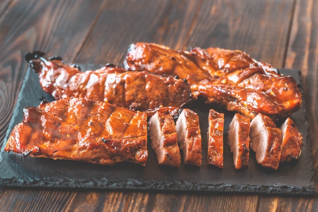 Char siu pork - Chinese bbq pork on the black stone board