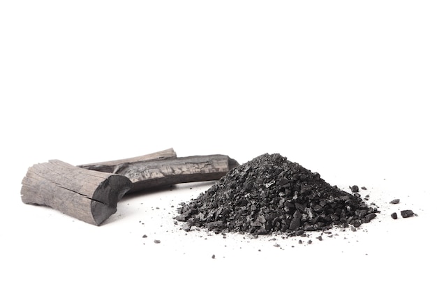 Charcoal and powder (activated carbon) on white background. 