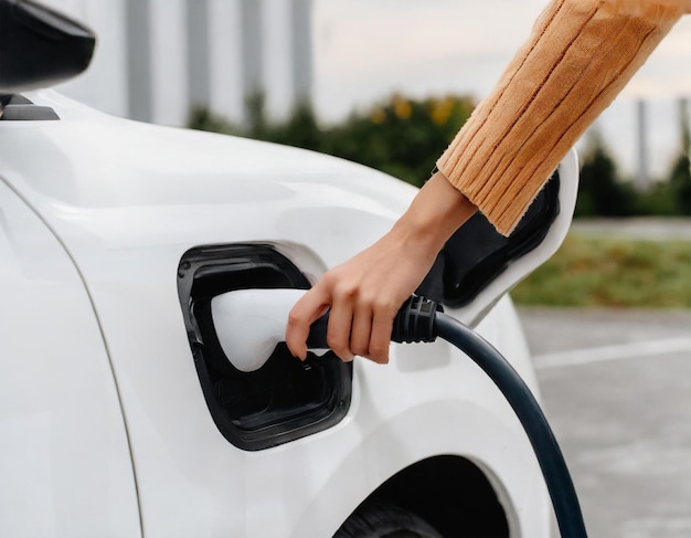 Charging an electric car in a parking lot