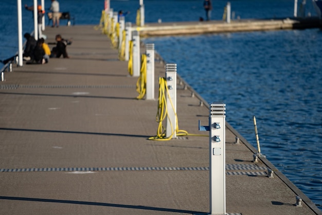 Charging station for boats electrical outlets to charge sailboats in empty harbor of marina