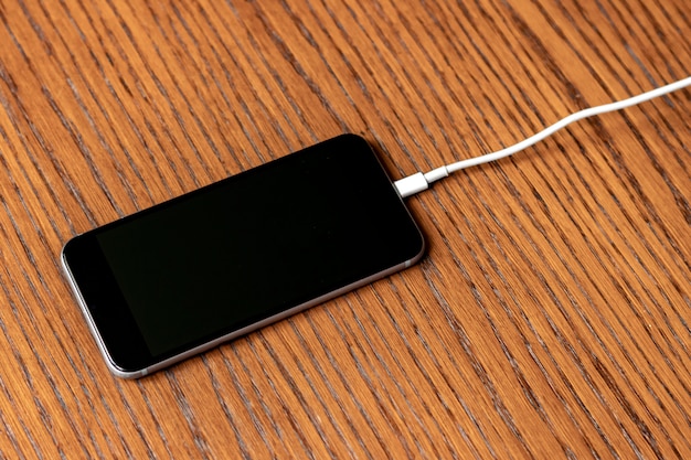 Charging wire inserted in smartphone isolated