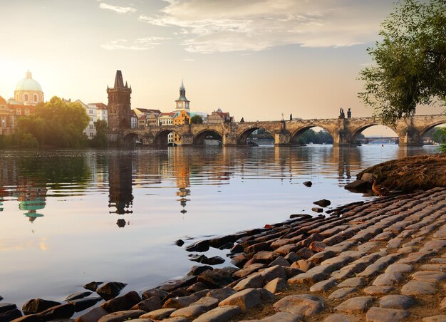 Charles Bridge on River Vltava in Prague at sunrise