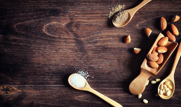 Charlotte with apples and nuts. Preparation of apple baking with nuts and honey. Dessert baked goods from apples and nuts with honey on a wooden table.