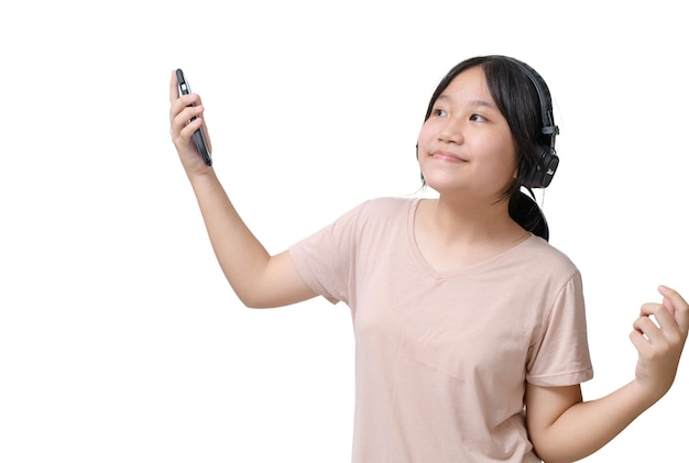 Charming asian girl wear headphones holding mobile phone listen music song mood enjoy on white background