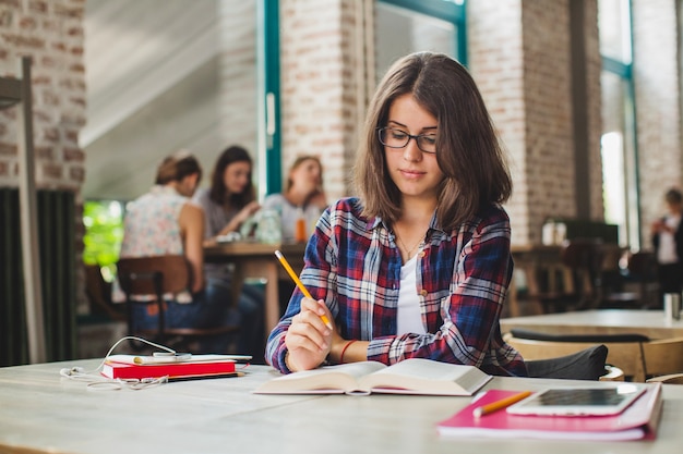 Charming brunette studying alone