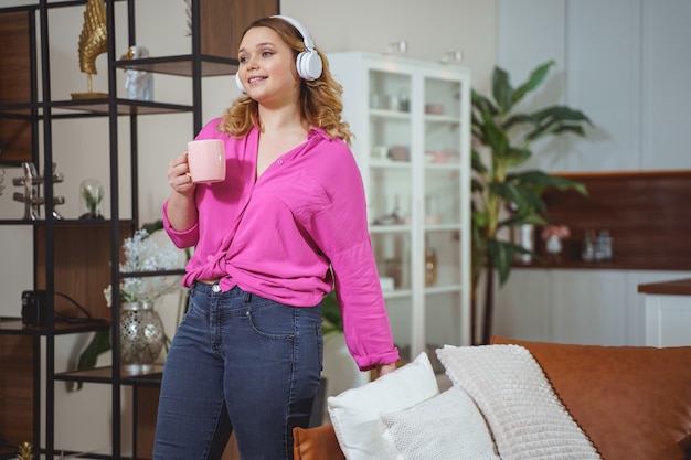 Charming girl expressing positivity, spending her weekend at home