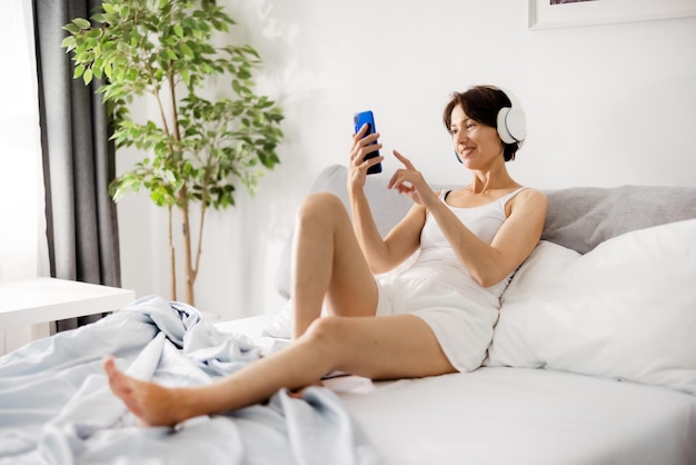 Charming mature woman using cell phone