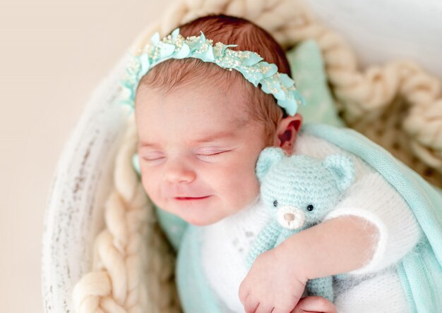 Charming smile of sleeping newborn