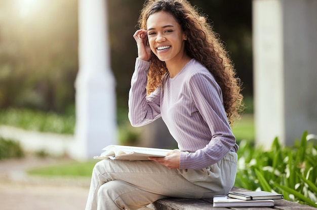 Chasing my dreams Shot of a young female student studying in nature