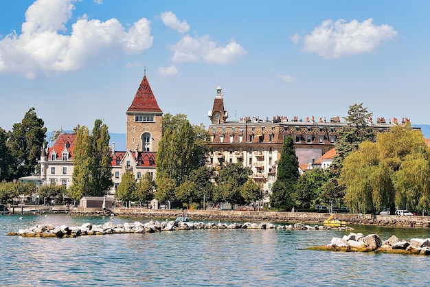 Chateau Ouchy at Lake Geneva promenade in Lausanne, Switzerland. People on the background