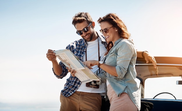 Photo check couple and map outdoor for navigation location search and destination for road trip happy people man and woman with paper for guidance direction and instructions for adventure journey