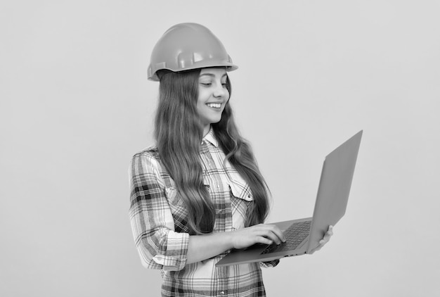 Check the email happy labour day future career teen girl in helmet use laptop