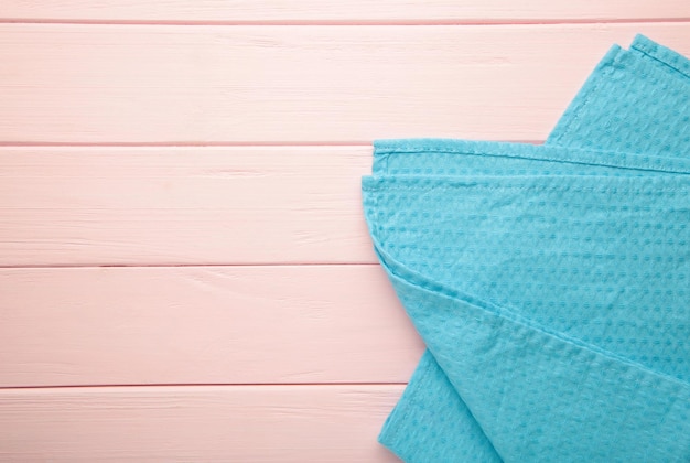 The checkered tablecloth on pink background Decorative blue cotton napkin