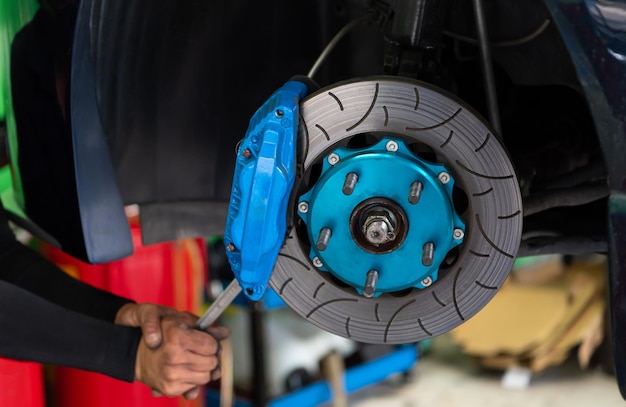 Checking car brake system for repair at car garage