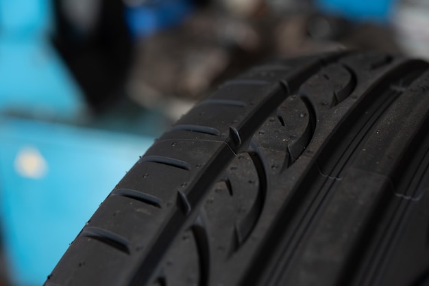 Checking a car wheel tire repair at car garage