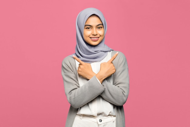 Cheerful attractive young Asian woman with smiling and keeping arms crossed