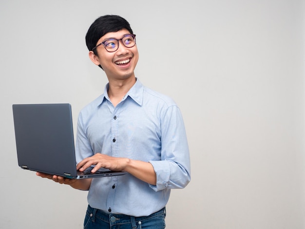 Cheerful businessman hold laptop smile looking at copy space