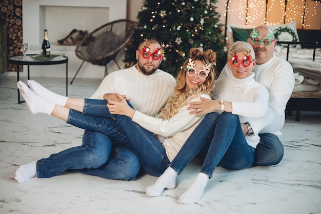 Cheerful Caucasian family in funny glasses