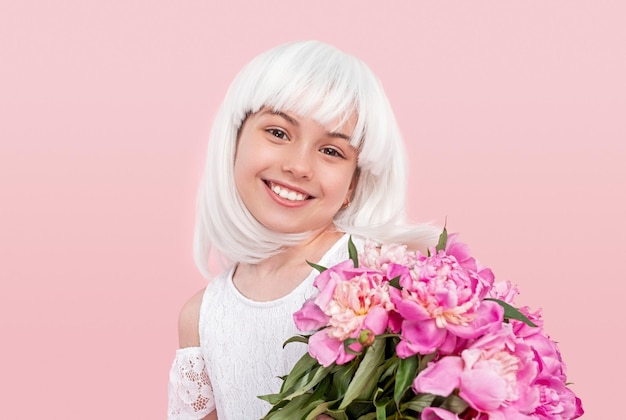 Cheerful child with bouquet of flowers