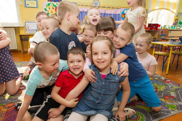 Cheerful children in kindergarten A group of sixyearold boys and girls