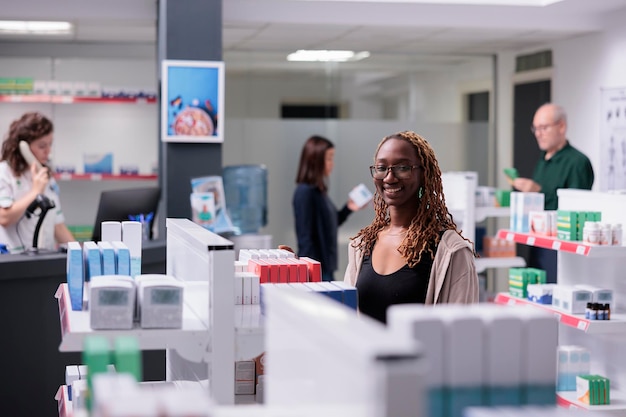 Cheerful client looking at shelves full of drugs, shopping for pharmaceutical supplements in drugstore. Client buying medication, vitamin to cure disease. Health care service support