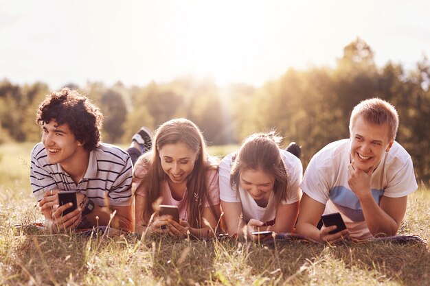 Cheerful companions smile while tell each other anecdotes