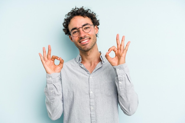 Cheerful and confident showing ok gesture