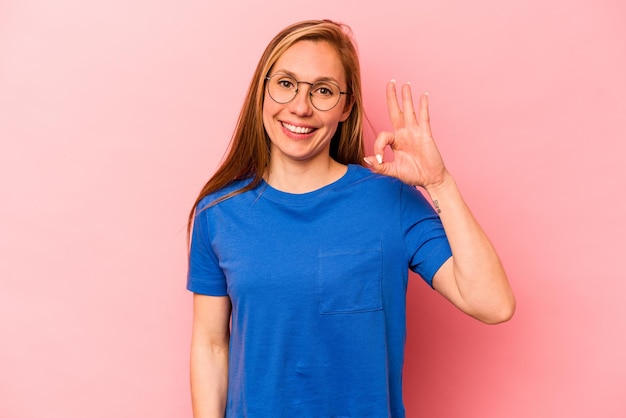 Cheerful and confident showing ok gesture