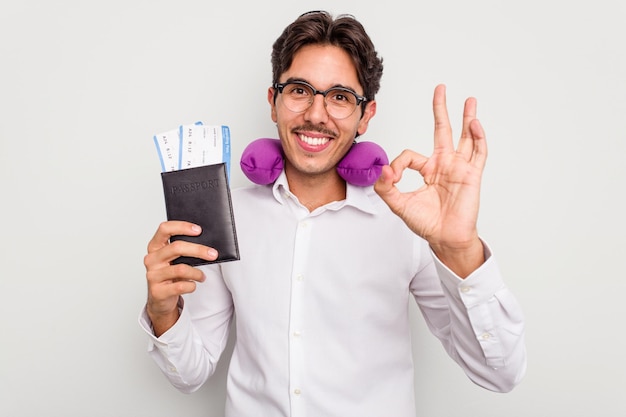 Cheerful and confident showing ok gesture