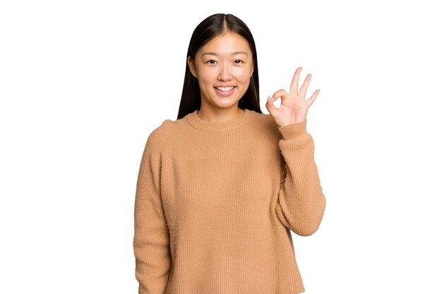 Cheerful and confident showing ok gesture