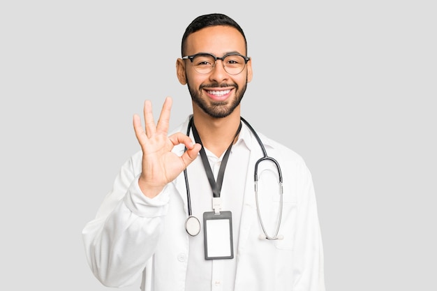 Cheerful and confident showing ok gesture