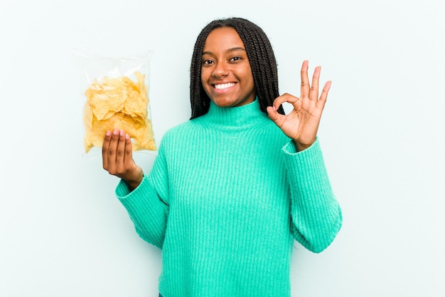 Cheerful and confident showing ok gesture