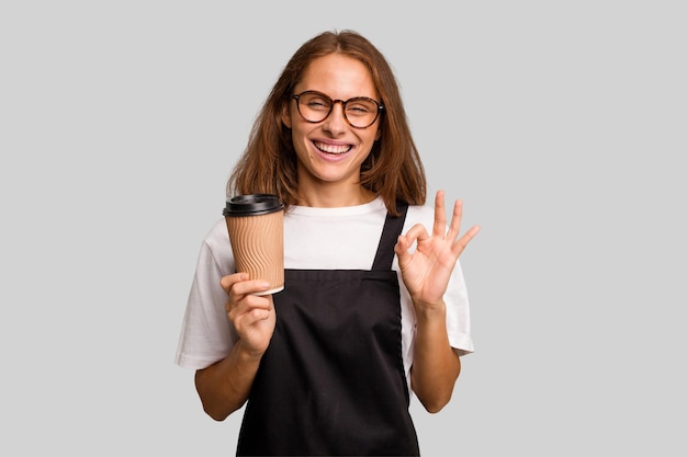 Cheerful and confident showing ok gesture