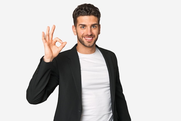 Cheerful and confident showing ok gesture