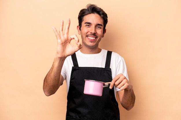 Cheerful and confident showing ok gesture