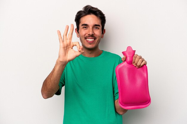 Cheerful and confident showing ok gesture