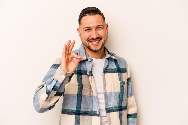 Cheerful and confident showing ok gesture