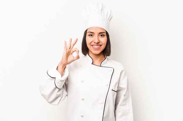 Cheerful and confident showing ok gesture