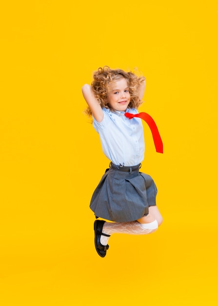 Cheerful cute genius positive little girl with curly hair 
