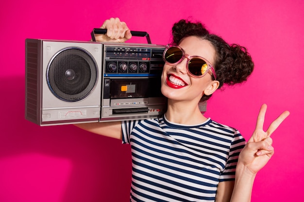 Cheerful cute girl on a pink background