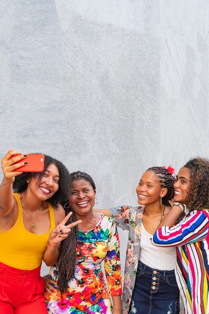 Cheerful diverse friends smiling while taking photos