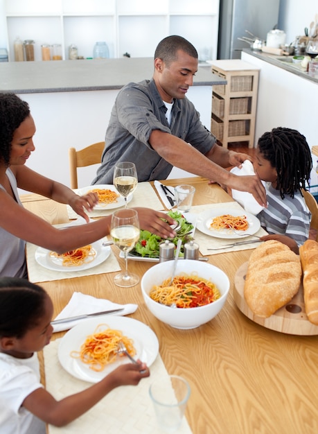 Cheerful family dining together