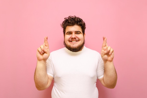 Cheerful fat man makes a wish